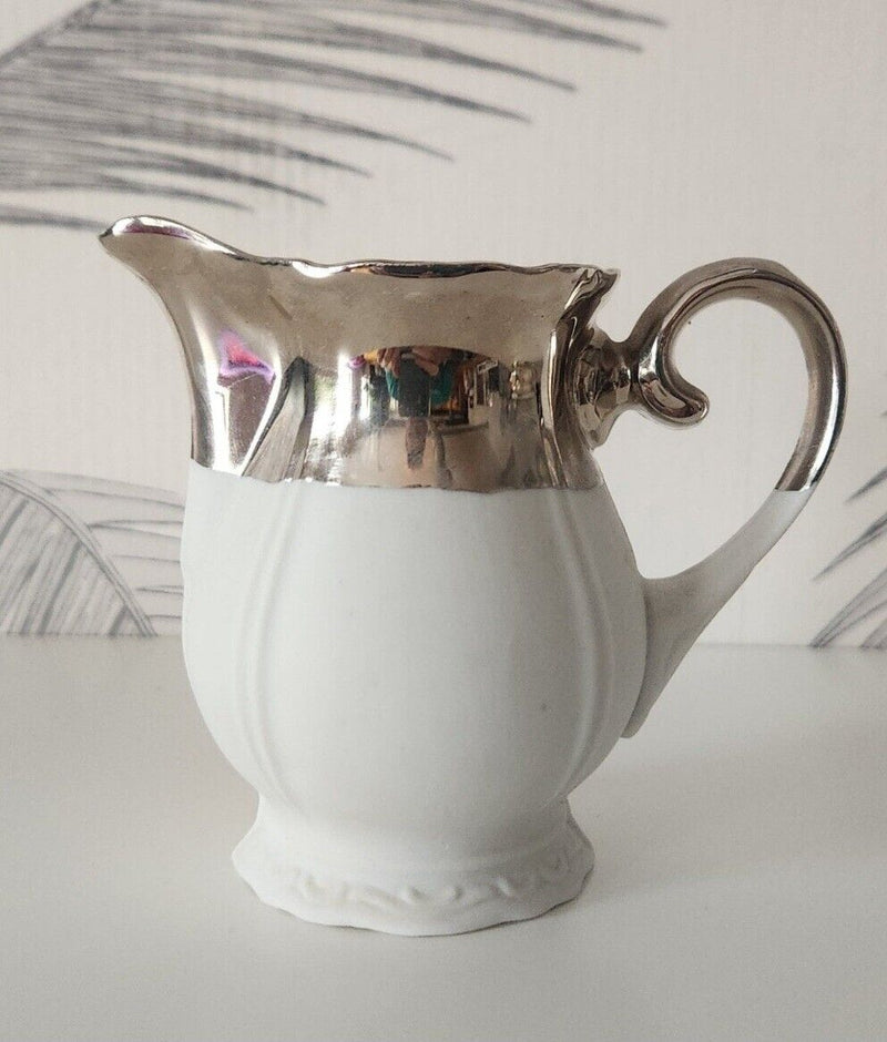 Silver biscuit creamer